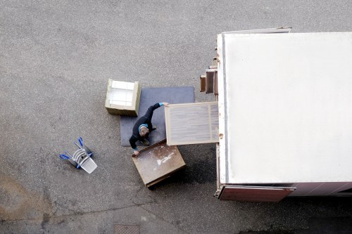 Professional movers loading a sofa for small removals in Edmonton